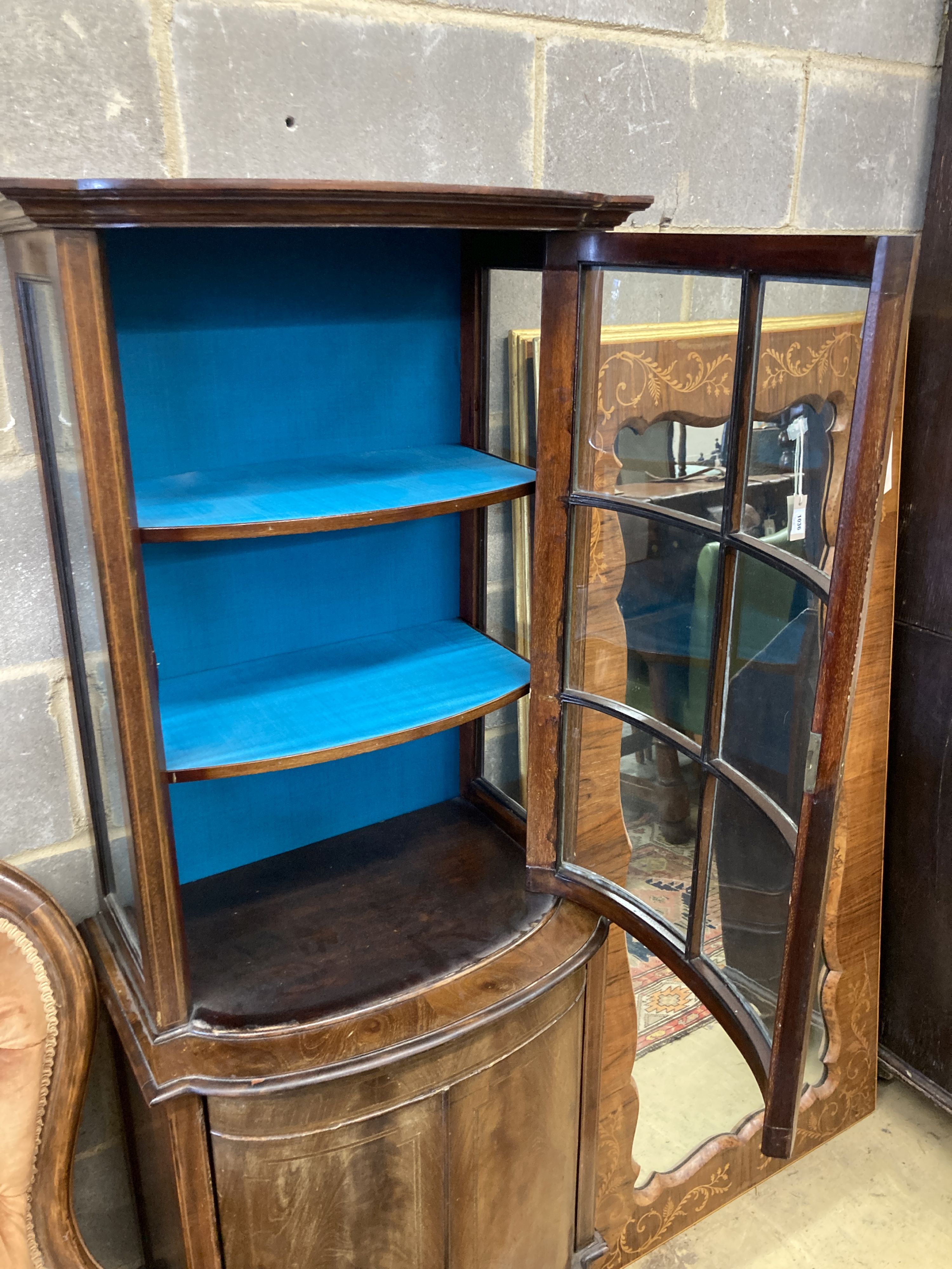 An Edwardian mahogany bowfront narrow display cabinet, width 60cm, depth 36cm, height 164cm